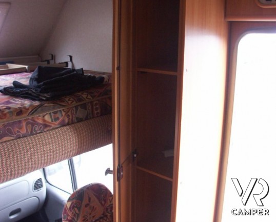 Elnagh Doral 108: camper mansardato usato in vendita a Torino con garanzie, dinette classica e letti a castello laterali su meccanica Ford Transit.