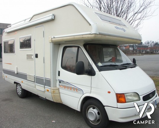 Elnagh Doral 108: camper mansardato usato in vendita a Torino con garanzie, dinette classica e letti a castello laterali su meccanica Ford Transit.