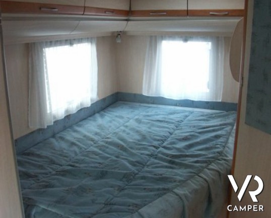 Fleurette Migrateur 67LG: camper semintegrale usato recente, con 4 posti letto, dinette avanzata ccon divano laterale e letto alla francese posteriore