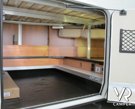 Hymer Tramp 554 SL: camper nuovo Hymer semintegrale con letto alla francese posteriore e portamoto estraibile.