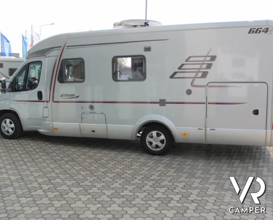 Hymer Tramp 664 SL: camper usato Hymer semintegrale con letto matrimoniale in coda, ampia dinette e bagno con doccia separata.