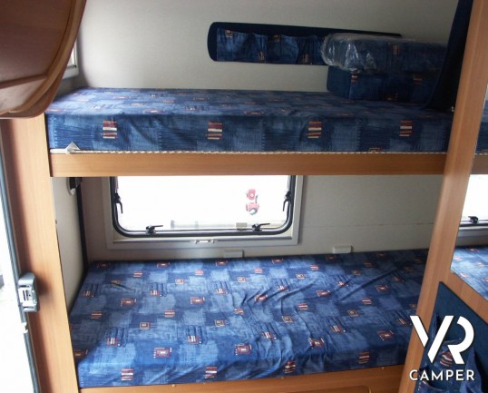 Roller Team Granduca 64: camper mansardato con letti a castello posteriori e ampio garage