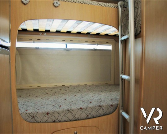 Arca 715 GLT: camper usato mansardato ideale per famiglie, con 7 posti letto, letti a castello in coda, veranda, portabici, su meccanica Ducato 146 cv