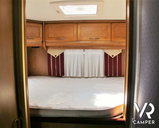 Rapido 9096: camper motorhome usato con ampia dinette, letto matrimoniale e letto basculante, bagno e doccia separati, garage per scooter.
